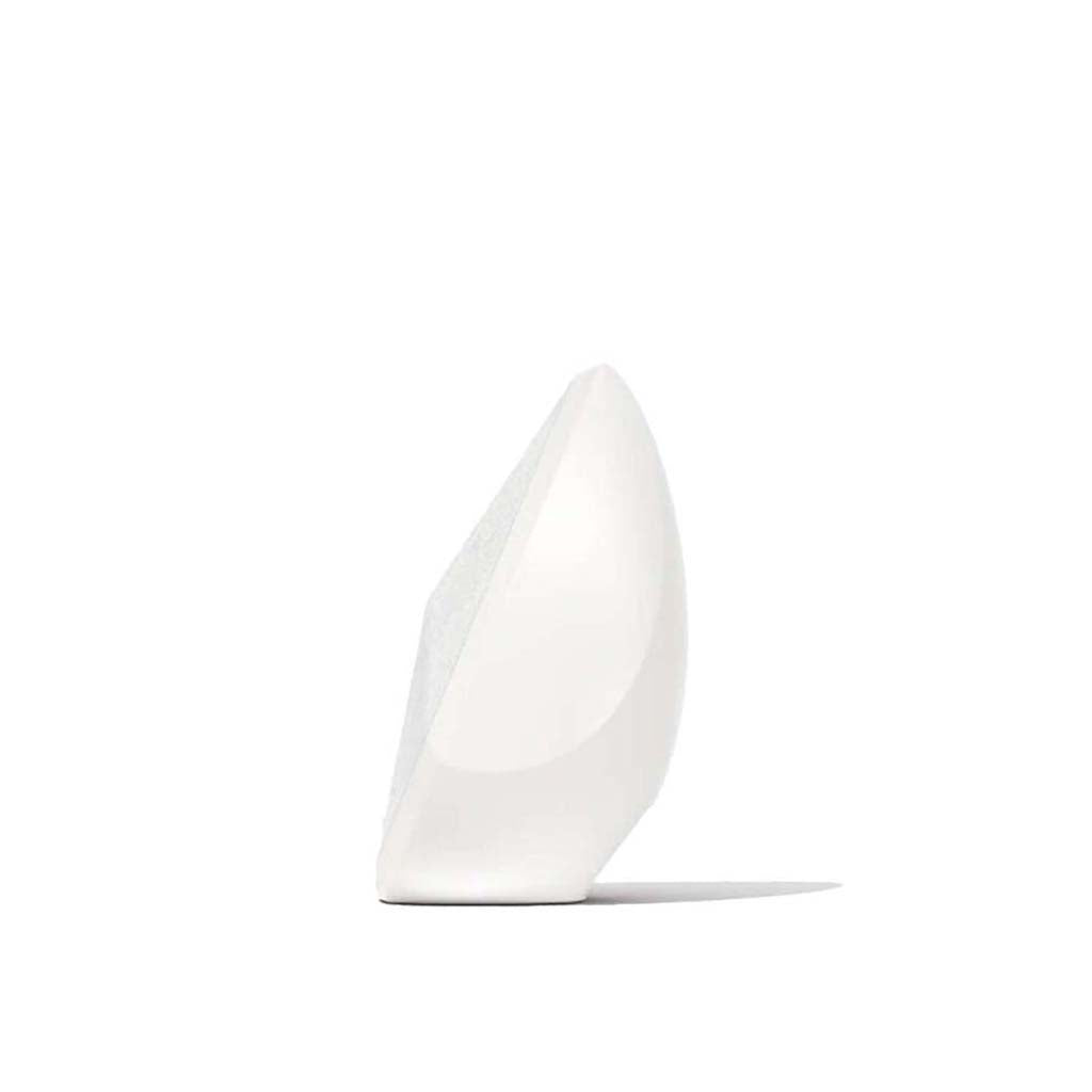 White wireless speaker, angled side view with smooth body on flat base