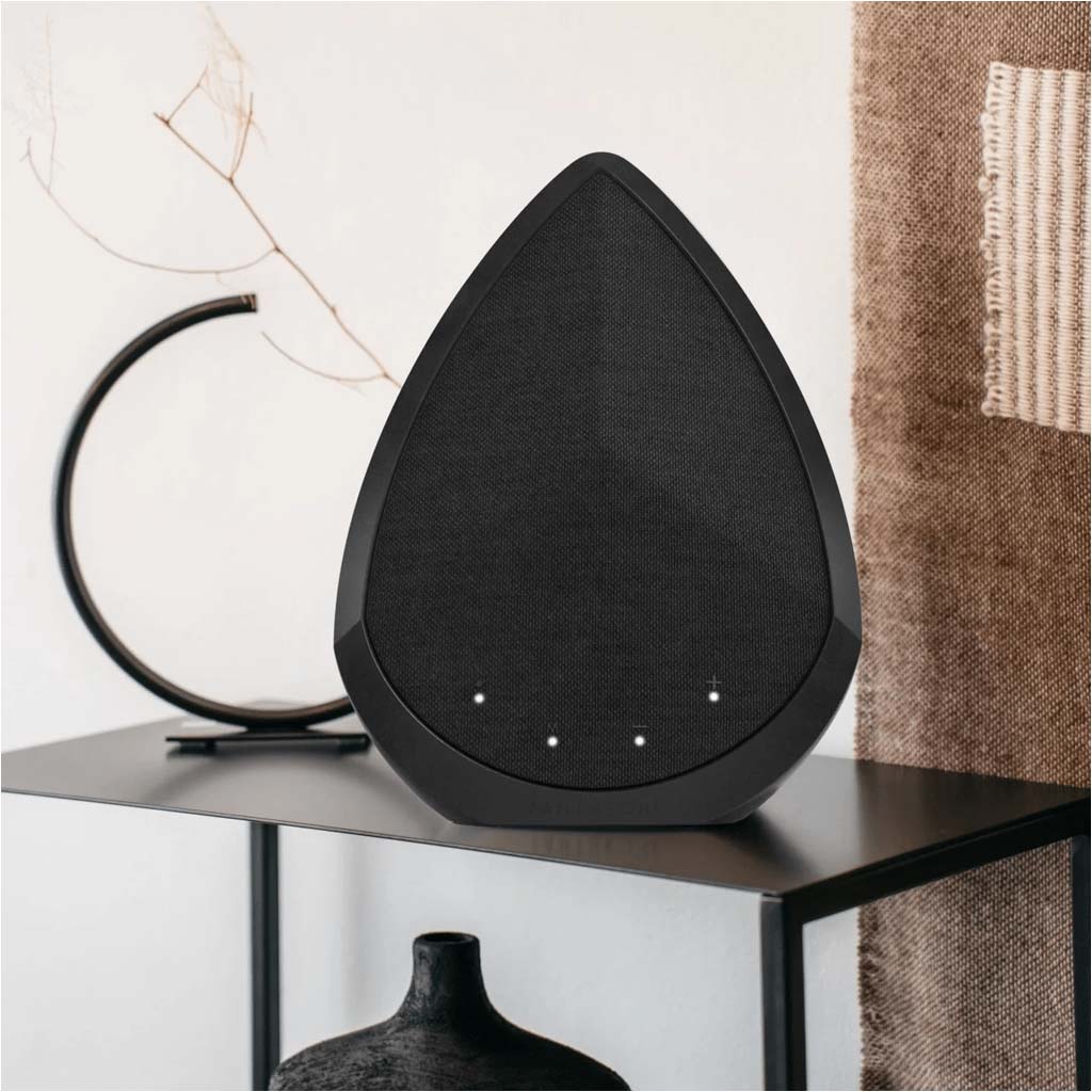 Black wireless speaker, triangular drop shape with front grille and indicator dots